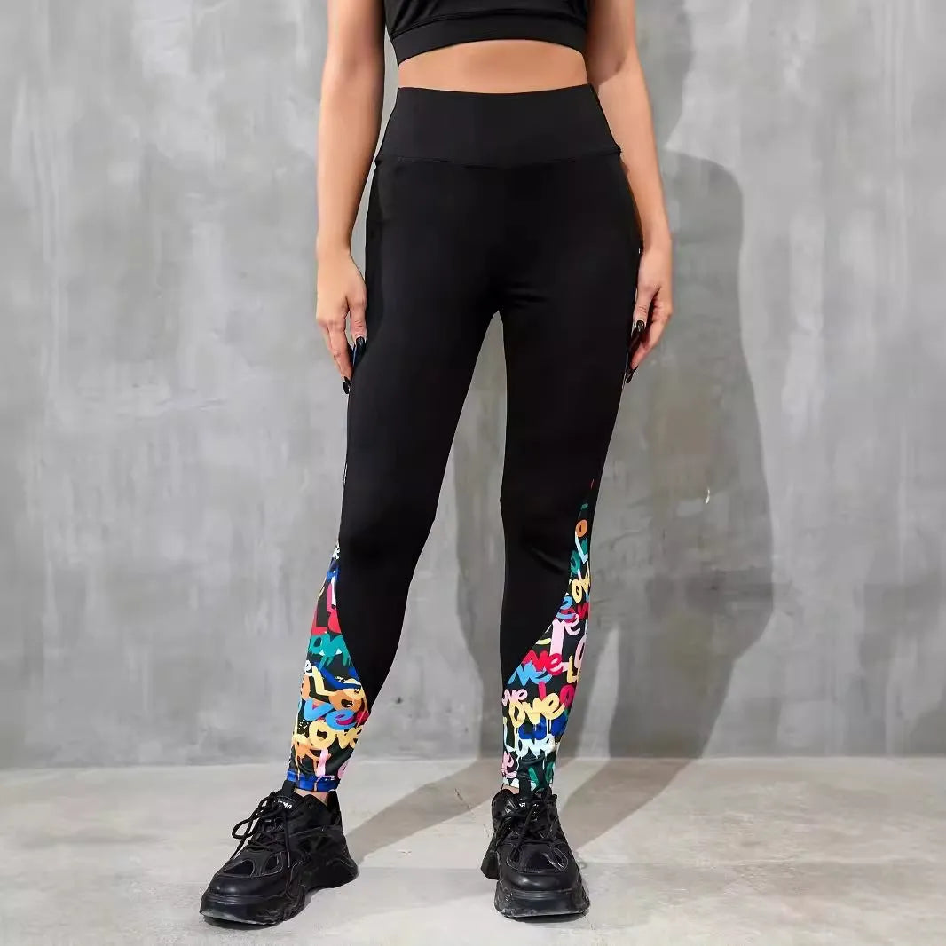 Woman wearing black ribbon letters colour contrast patchwork high waist yoga leggings with pocket
