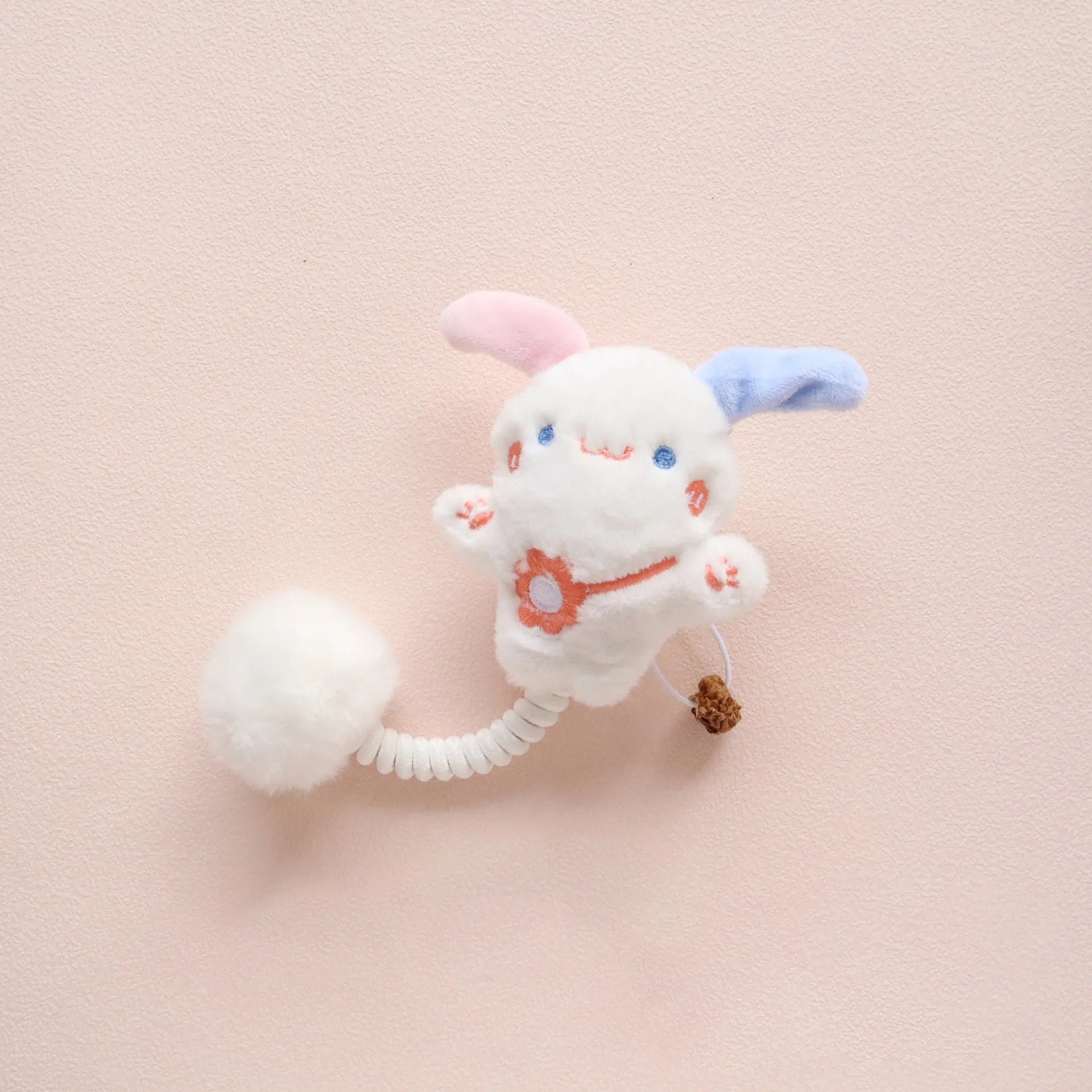 4-in-1 cat toy with plush animal, silvervine fruit, stretchable spring and fuzzy ball on white background