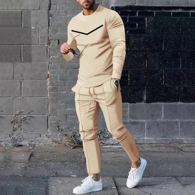 Men's cotton blend round neck long sleeve T-shirt and trousers tracksuit set in light gray on a plain background