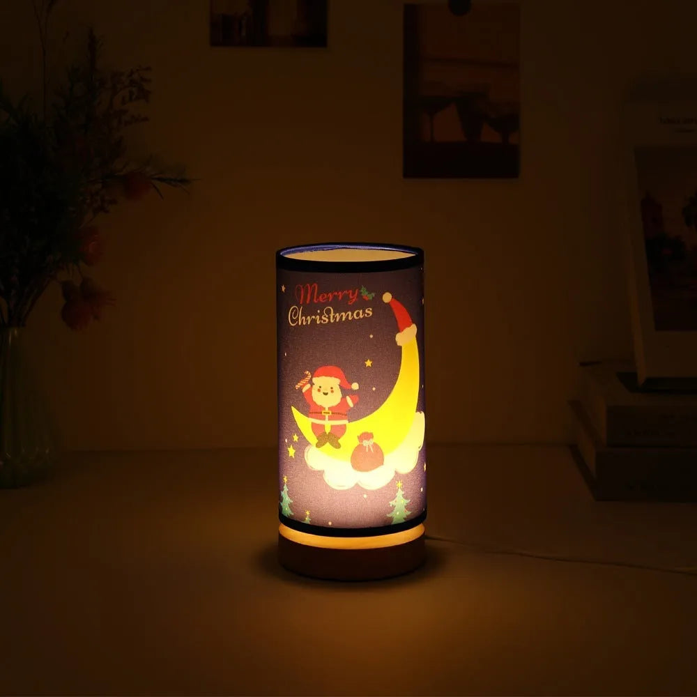 Moon Santa Claus design LED night light with bamboo base and USB plug.