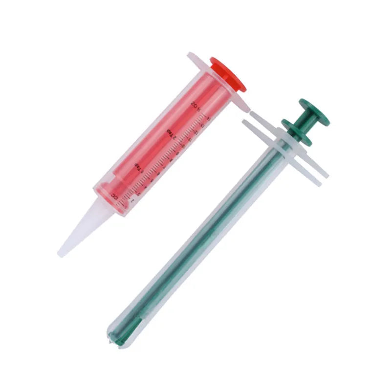 Two pet pill shooter guns with soft silicone tips in different sizes for cats and dogs