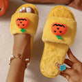 White and yellow Halloween pumpkin plush slippers with open toe and synthetic fur upper