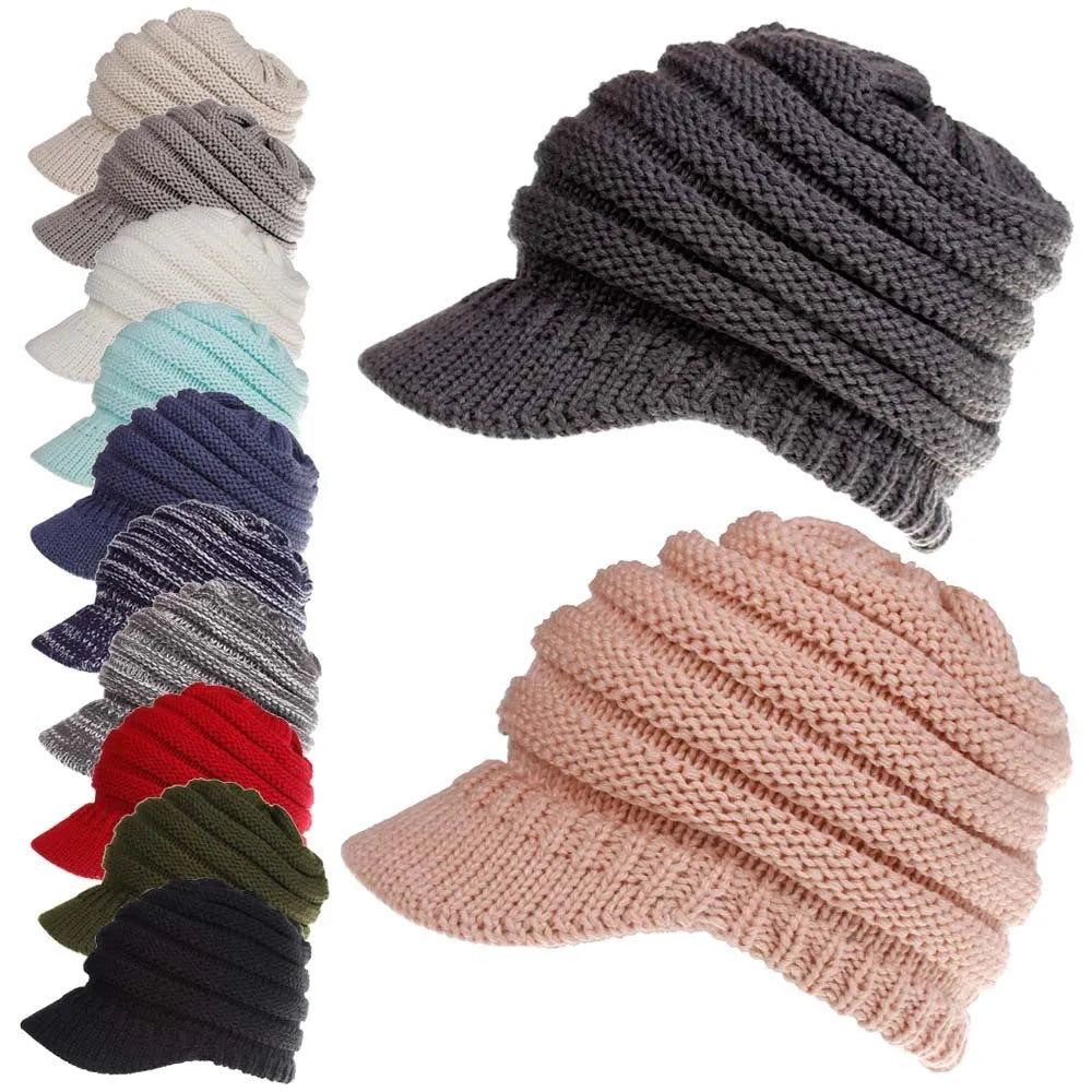 A soft grey acrylic knitted beanie for women, worn over a ponytail.