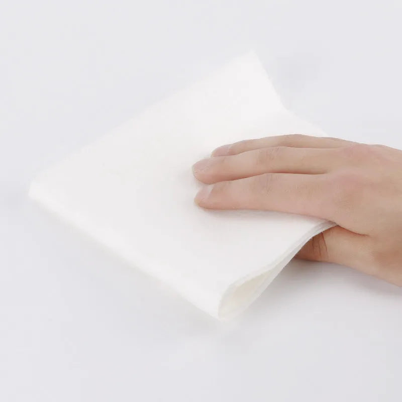 Reusable bamboo kitchen paper towel roll on countertop, absorbent and washable cloth alternative to disposable towels