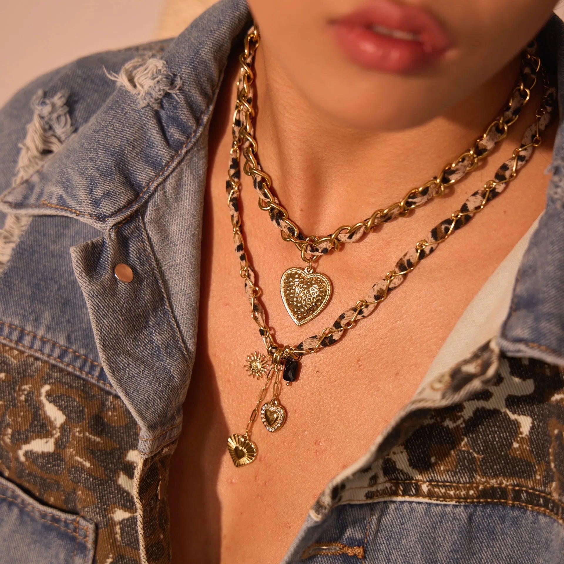 Geometric leopard love pendant on adjustable stainless steel necklace chain with gold-toned finish