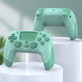 PS4 wireless Bluetooth gamepad in fruit green colour on a desk, with vibration and force feedback functions