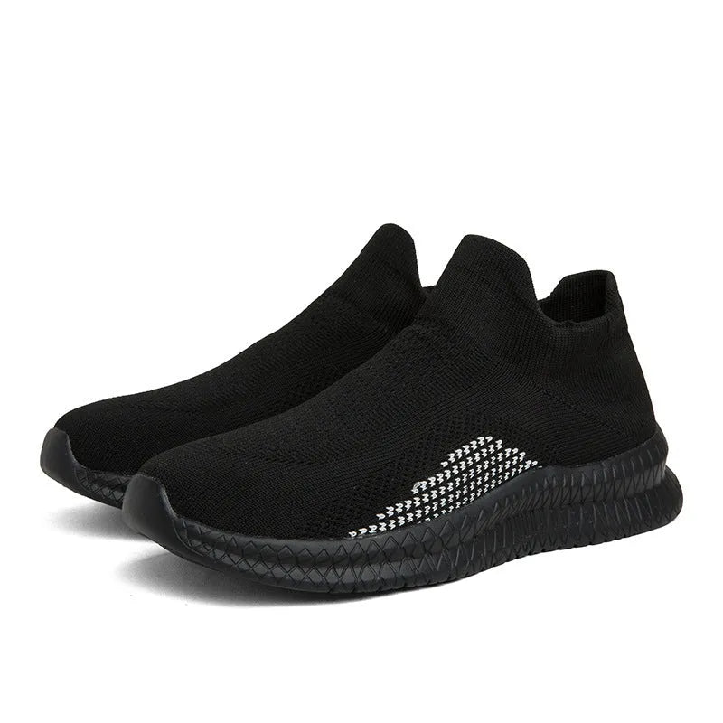 Popcorn Flyknit low-top fabric casual sneakers in black, shown from the side on a white background.