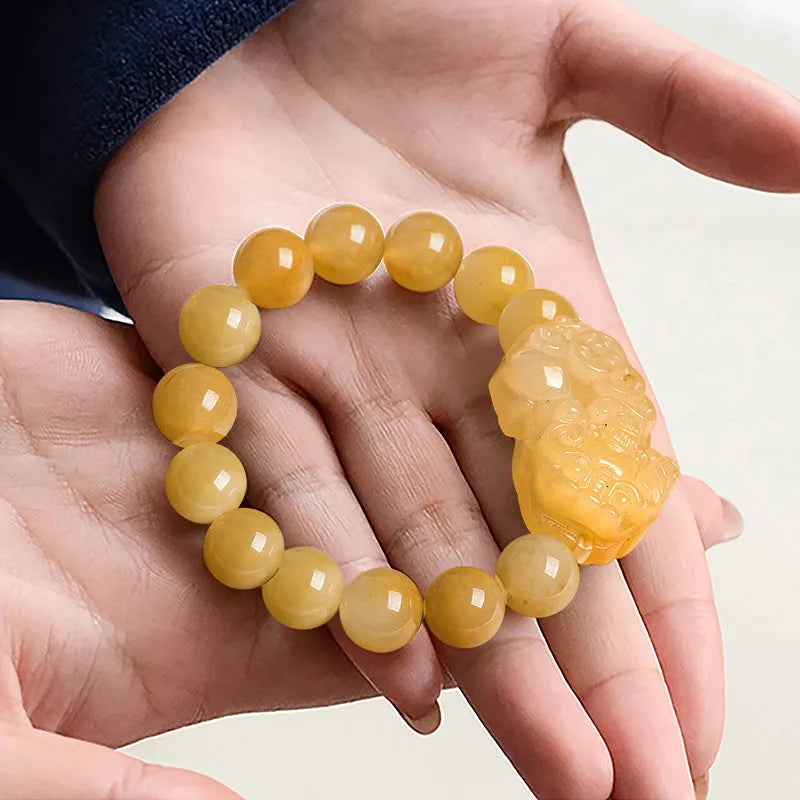 Carved Jinsi Jade money bracelet in golden thread jade colour showing large and small size options.