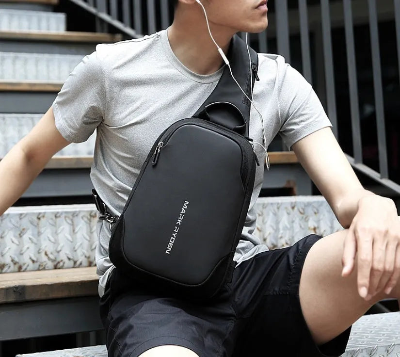 Men's anti-theft USB chest bag in black, made from Oxford cloth with zip closure and square vertical shape