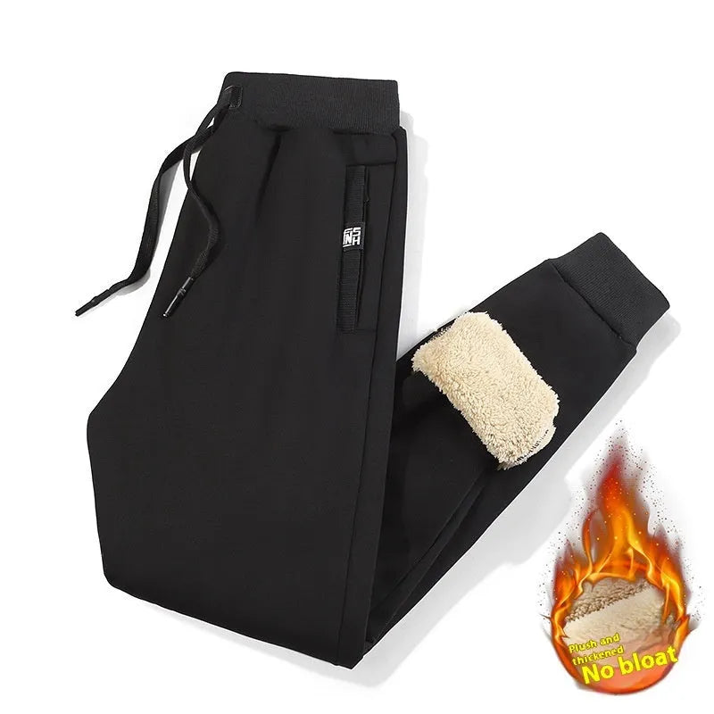 Men's grey fleece-lined oversized cotton track pants with a straight leg, shown on a hanger.