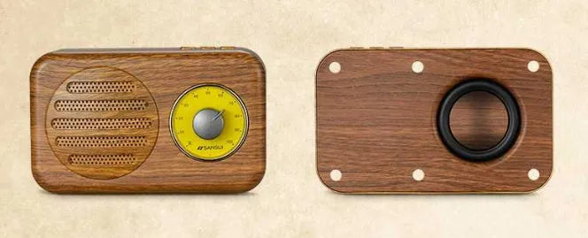 T1 portable Bluetooth speaker in wood grain pink with vintage finish, compact size, and FM radio support