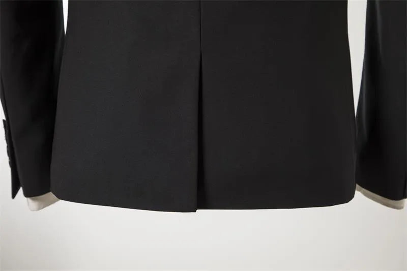 Men's black slim-fit one-button business suit with flat collar and rear slit on a hanger.