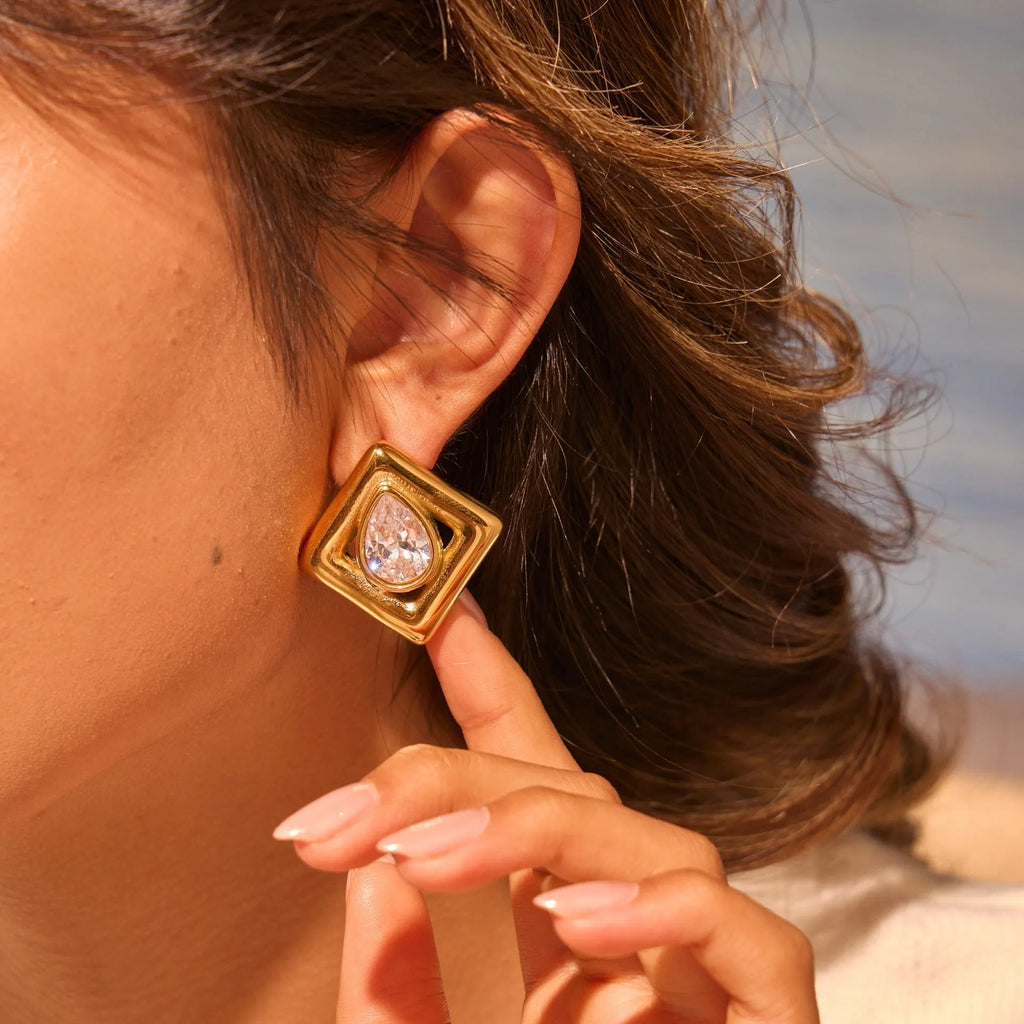 Gold electroplated stainless steel stud earrings with water drop zircon design