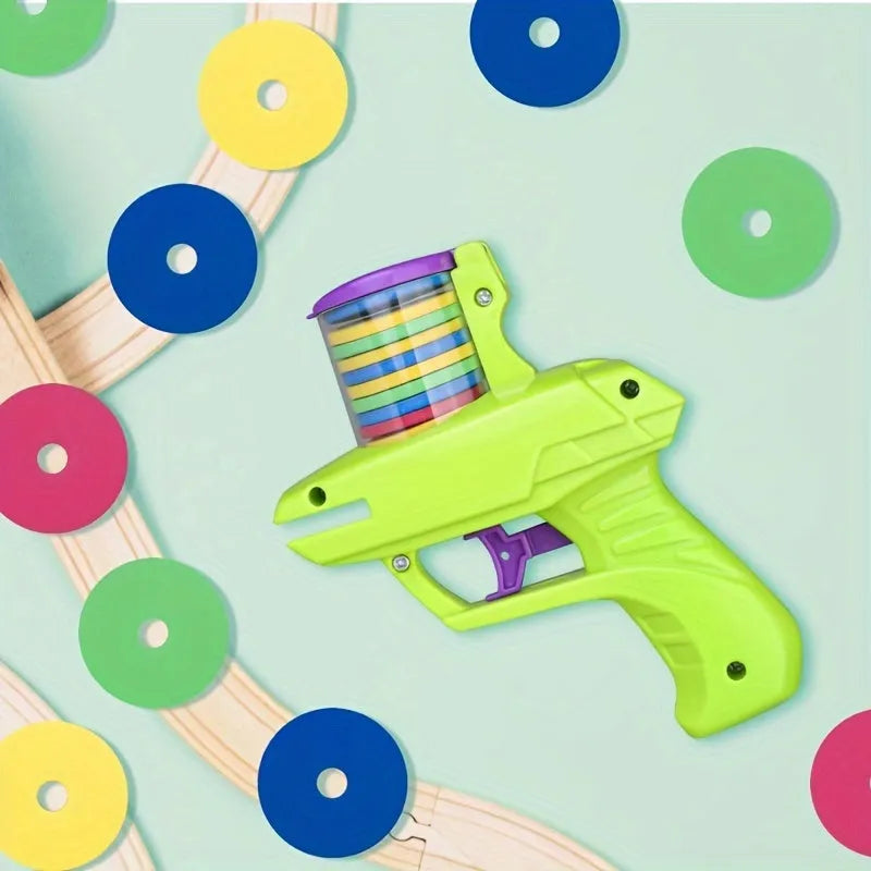 Interactive cat toy launcher with foam discs in green and purple colour options for battery-free feline play