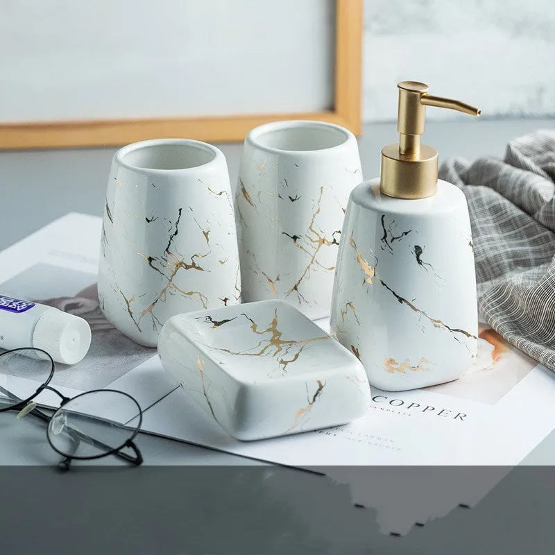 Ceramic bathroom wash set in white with decal finish, three pieces on countertop