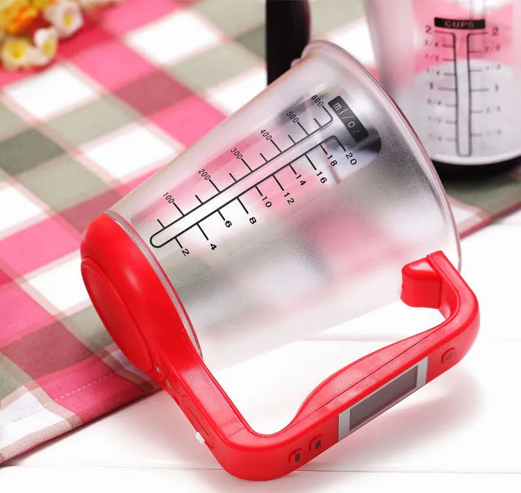 Green digital measuring cup scale with LCD display in handle on white background