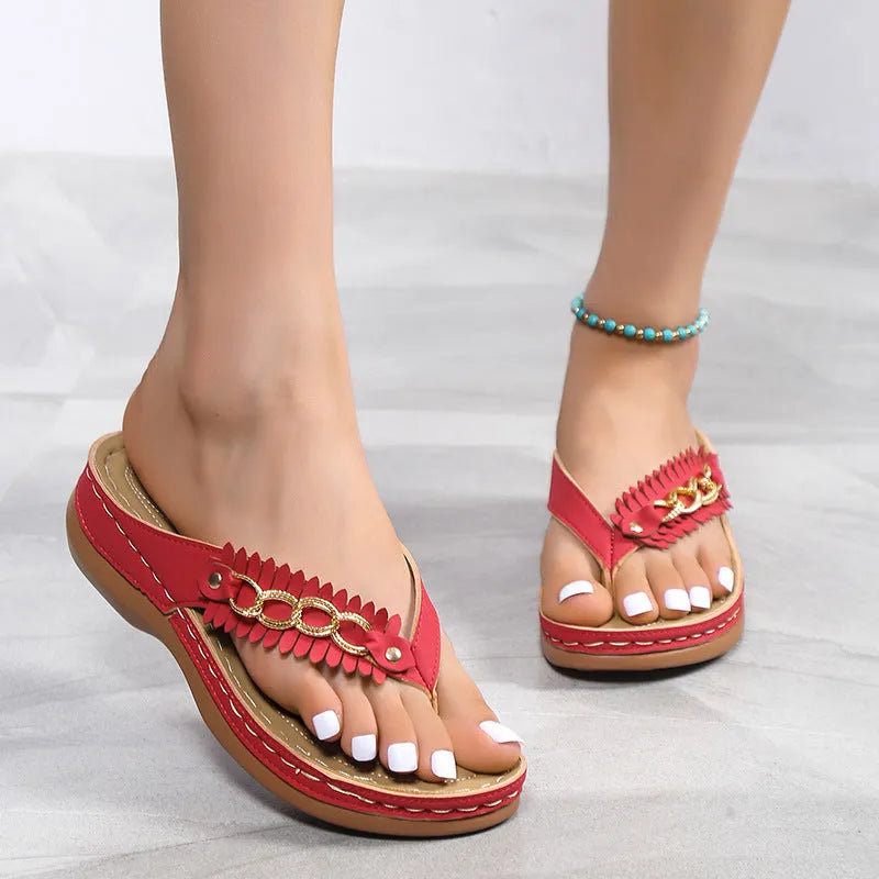 Women's anti-slip wedge sandals with chain detail in black, dark brown, and red on a light background