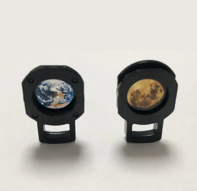 A 2 in 1 earth and moon projection lamp with a flexible hose bracket on a table