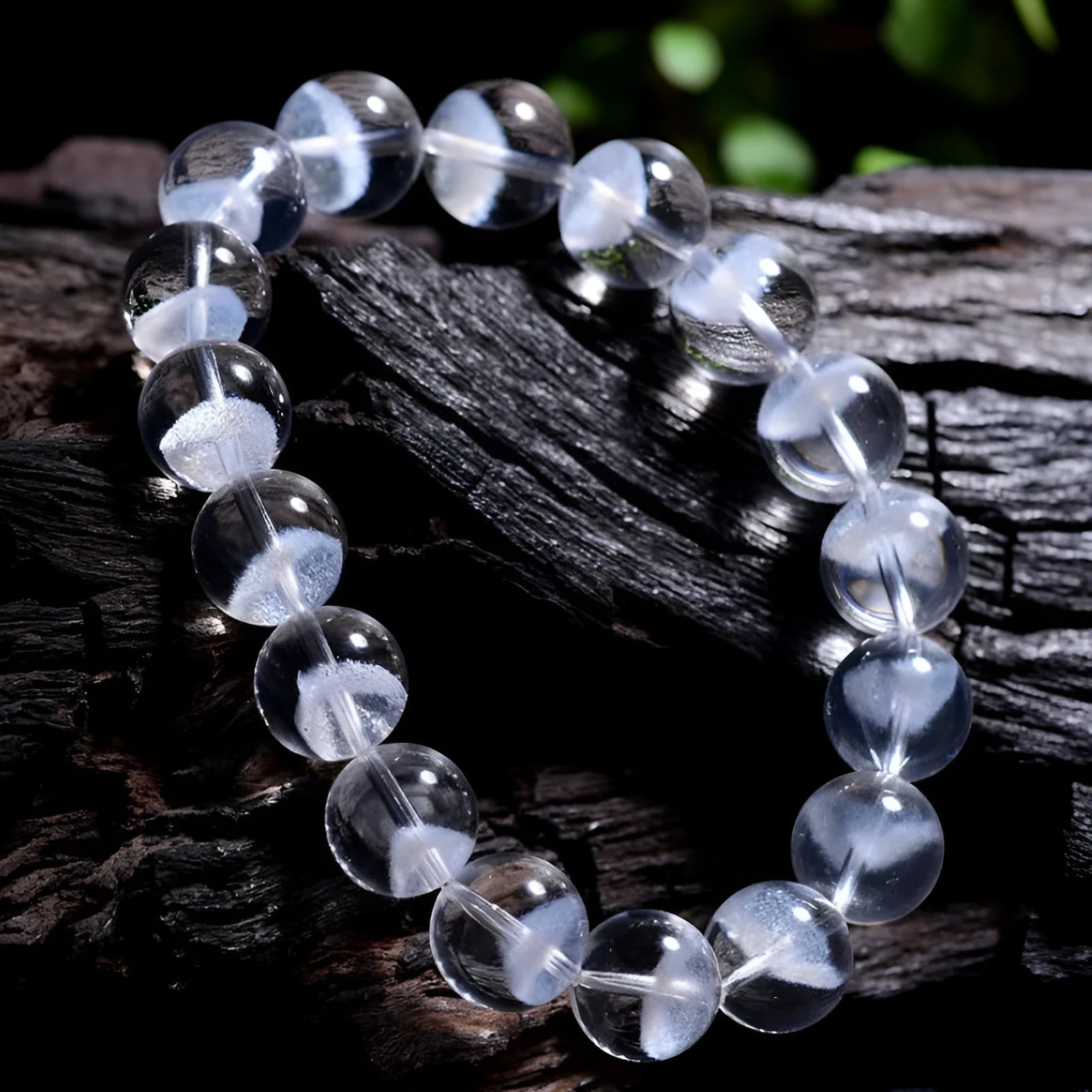 Women's natural white ghost pyramid crystal bracelet showing textured surfaces and ruyi charm detail