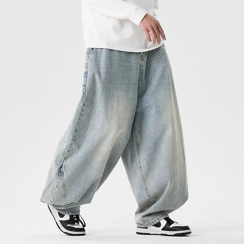 Men's plus size baggy jeans in light blue cotton denim with wide leg straight cut