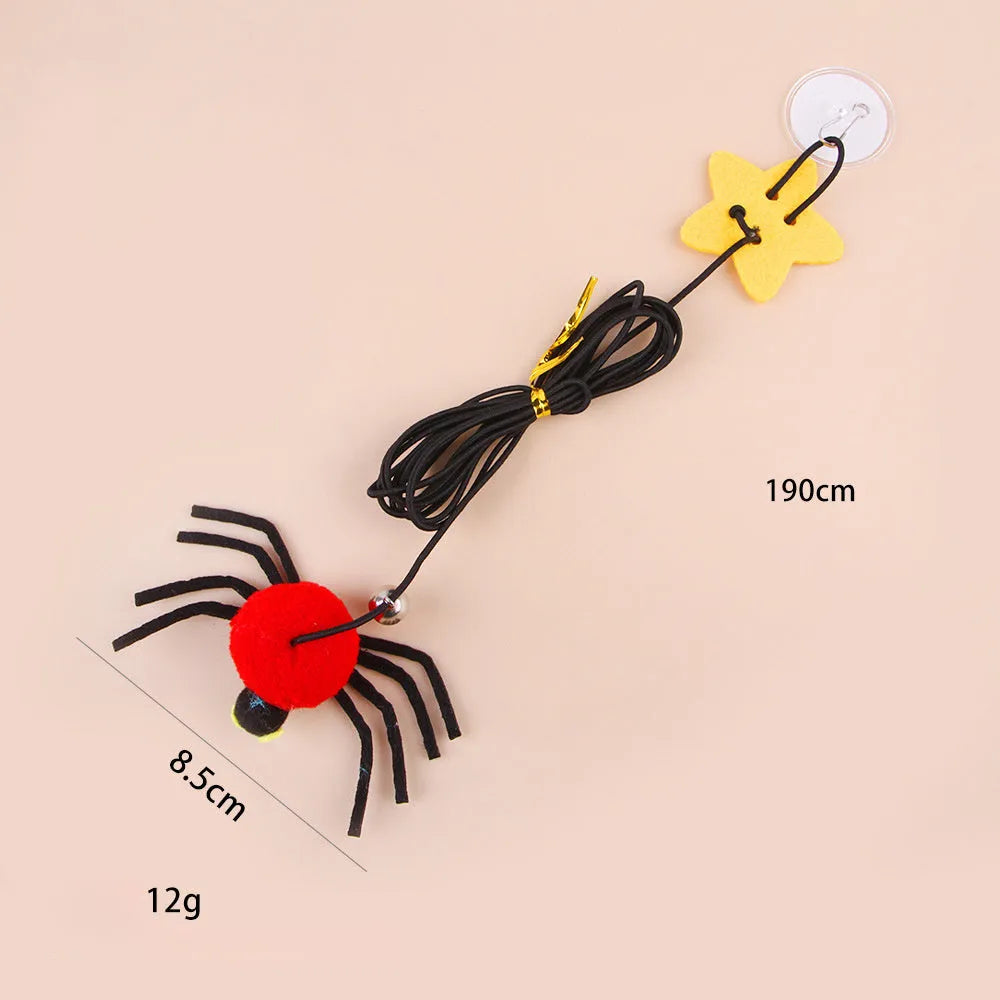 Red cat hanging toy with feather stick and bell spider on elastic rope mounted to door