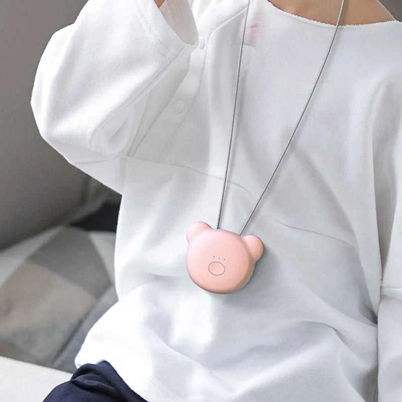 Mini USB portable air purifier necklace in blue colour, showing wearable design and single button.