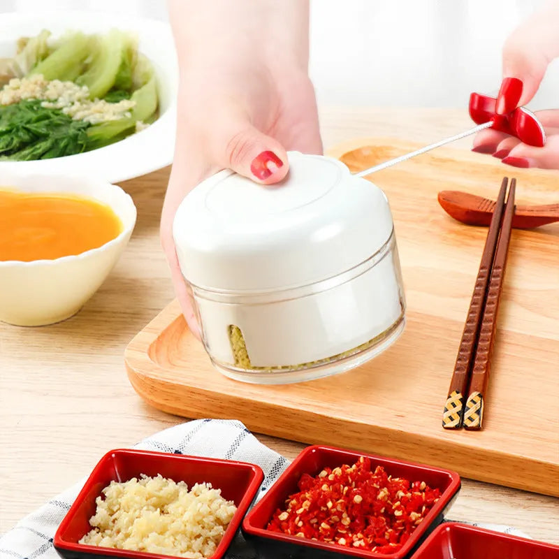 White manual food chopper with 304 stainless steel blades and magnetic attachment, 8.5 x 7 cm size
