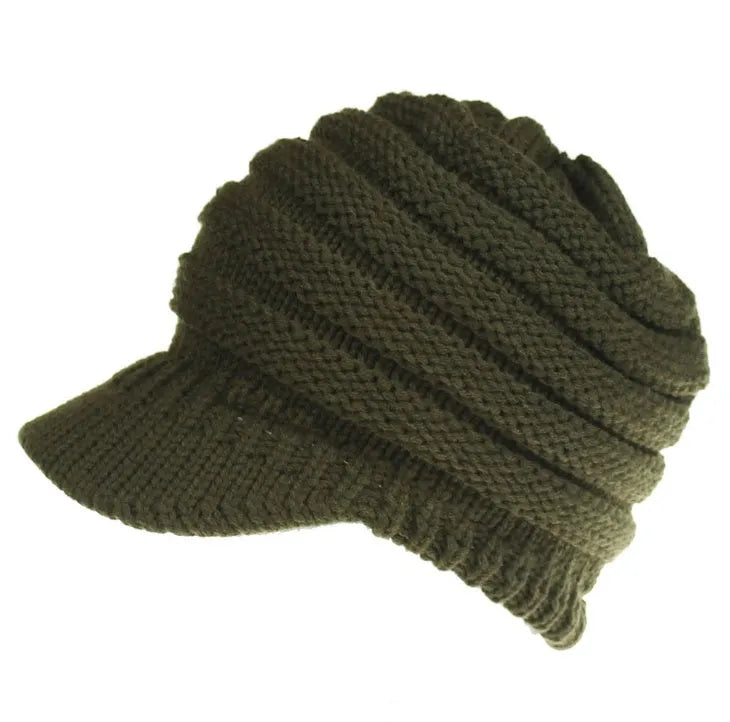 A soft grey acrylic knitted beanie for women, worn over a ponytail.