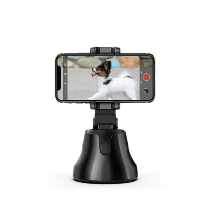 Black smartphone automatic shooting selfie stick with 360° face tracking on three-foot bracket showing phone holder and rotation mechanism