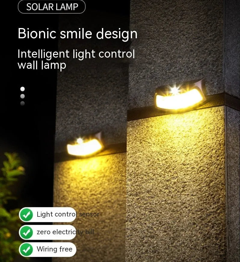 Solar outdoor garden wall lamp with smiling face design for courtyard lighting