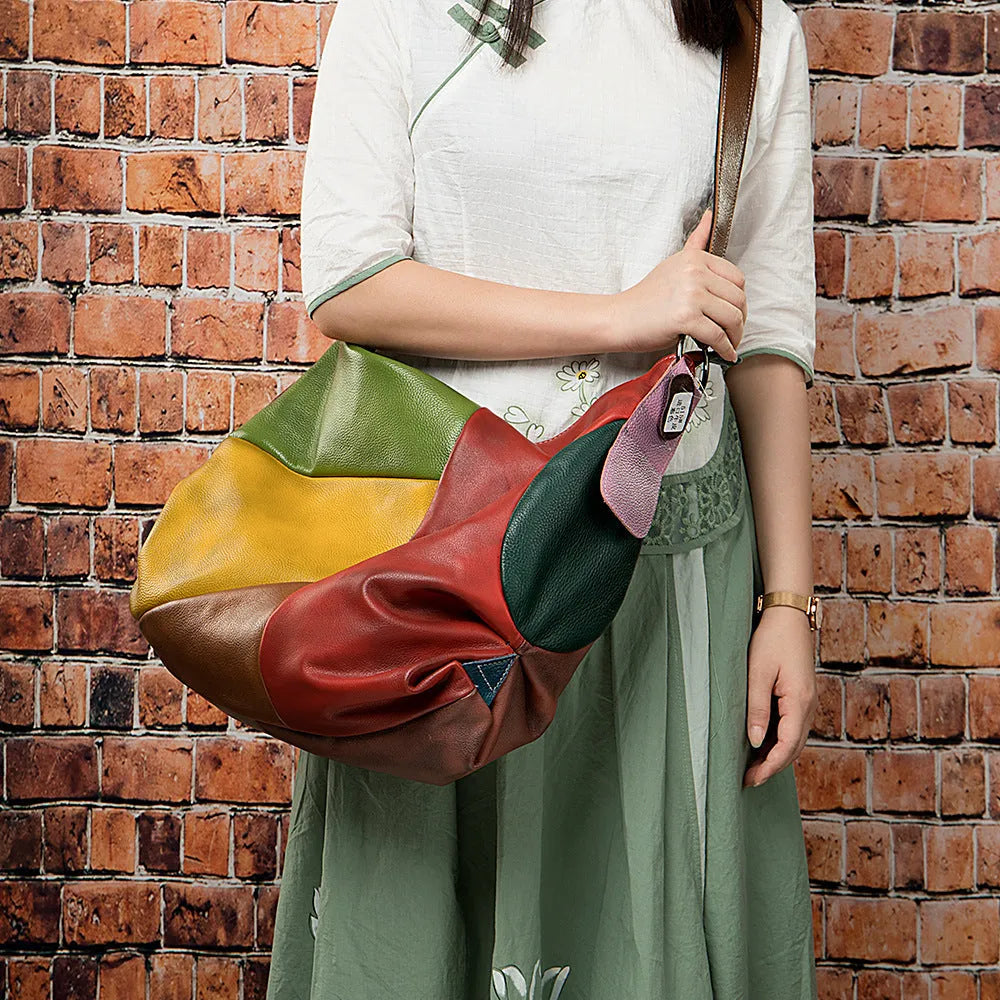 Brown cowhide leather crossbody travel bag showing front view and size scale.