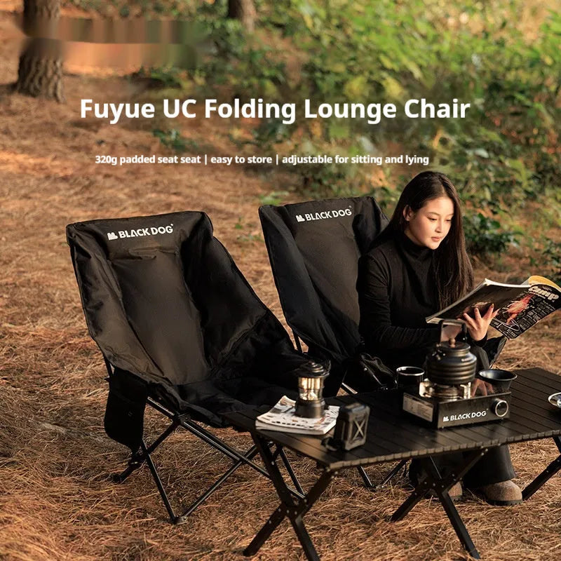 Night Black Oxford cloth portable folding camping recliner chair on grass.