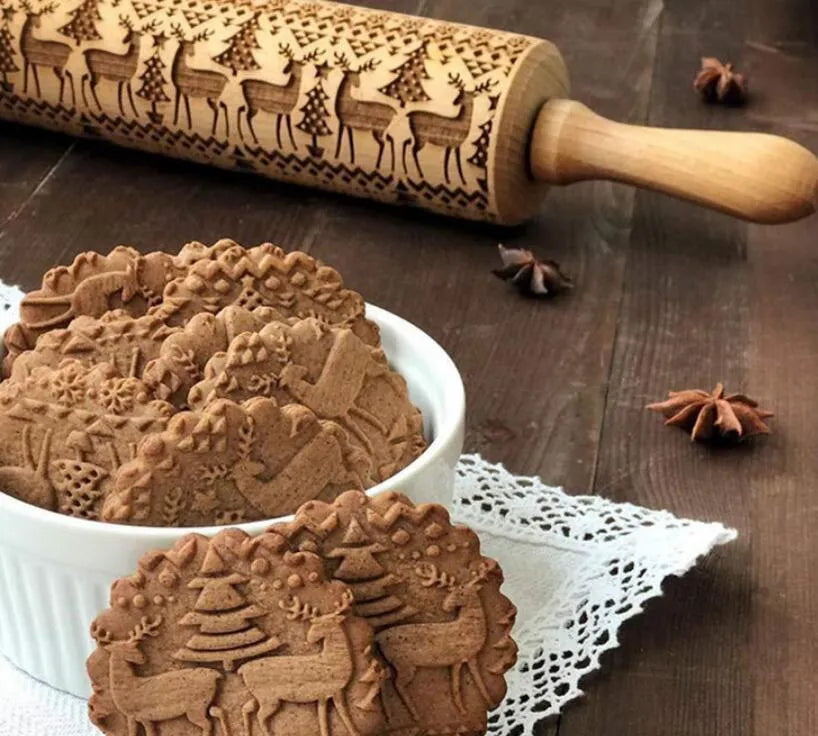 Natural wooden rolling pin with Christmas embossing patterns, 45 cm length, on a light background