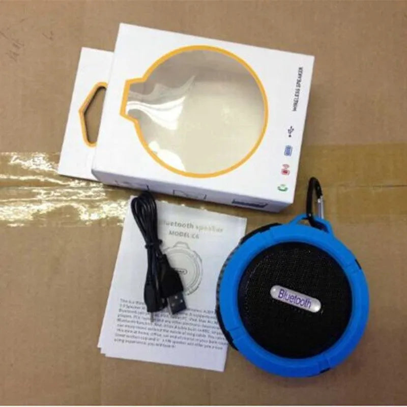 Portable waterproof Bluetooth stereo speaker in plastic housing with mountaineering buckle, available in multiple colours