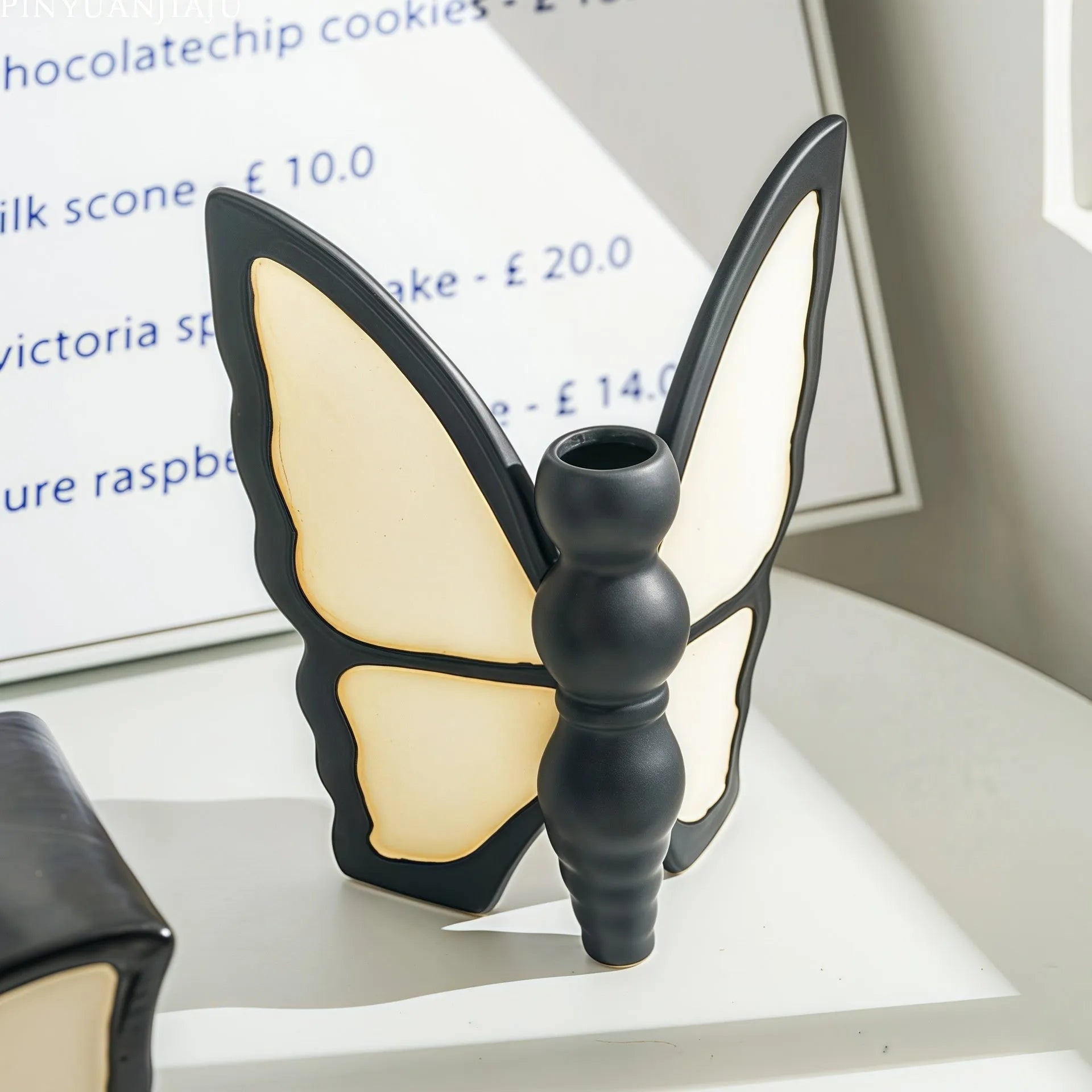 Ceramic light luxury butterfly tissue box and vase set on a living room side table