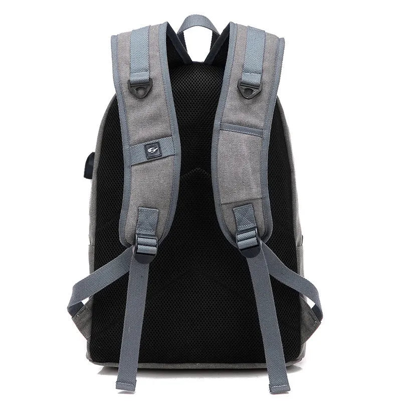 Canvas backpack with USB charging port showing coffee colour variant with laptop compartment