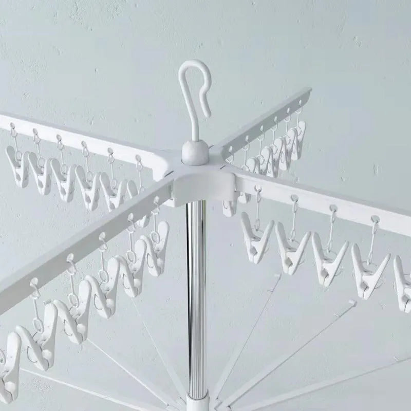 Stainless steel three-tier laundry drying rack with plastic clips and an integrated clothes hanger.
