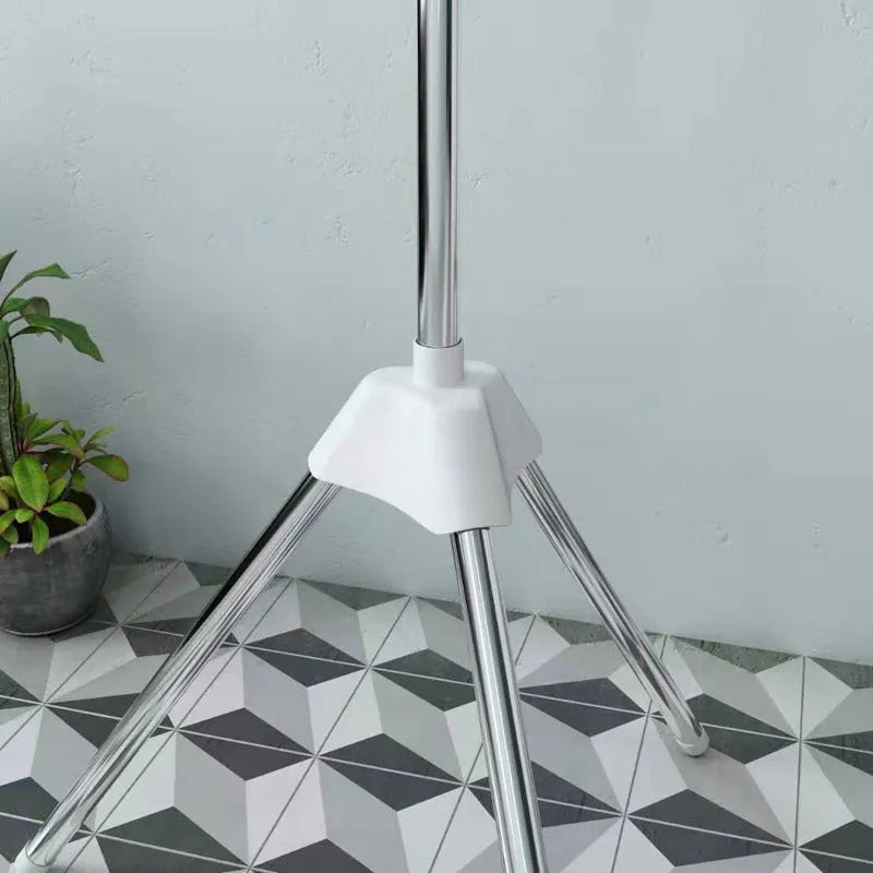 Stainless steel three-tier laundry drying rack with plastic clips and an integrated clothes hanger.