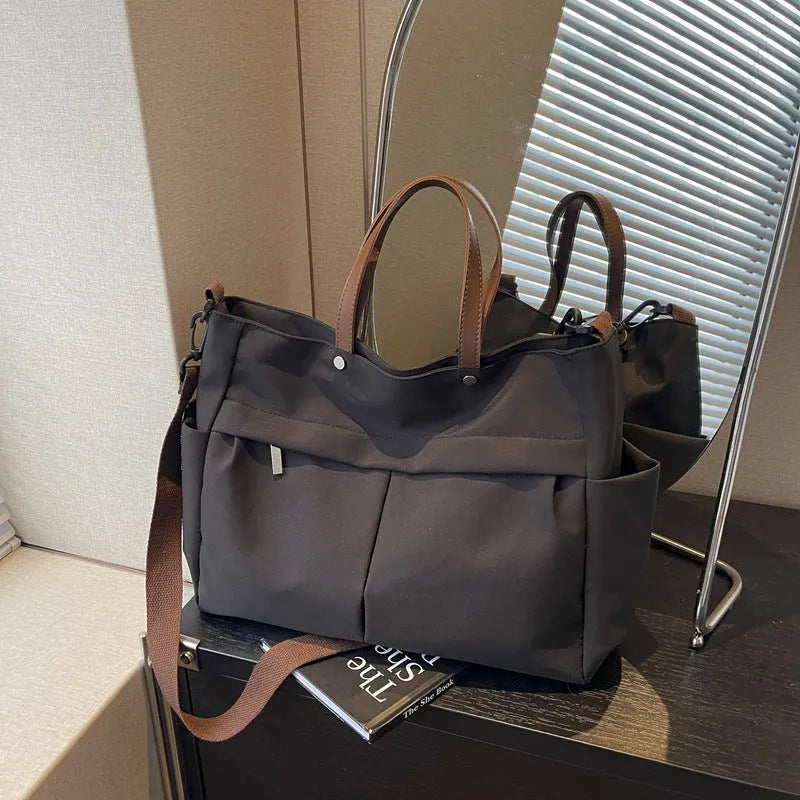 Nylon crossbody tote bag in milky white with short shoulder strap and flat base