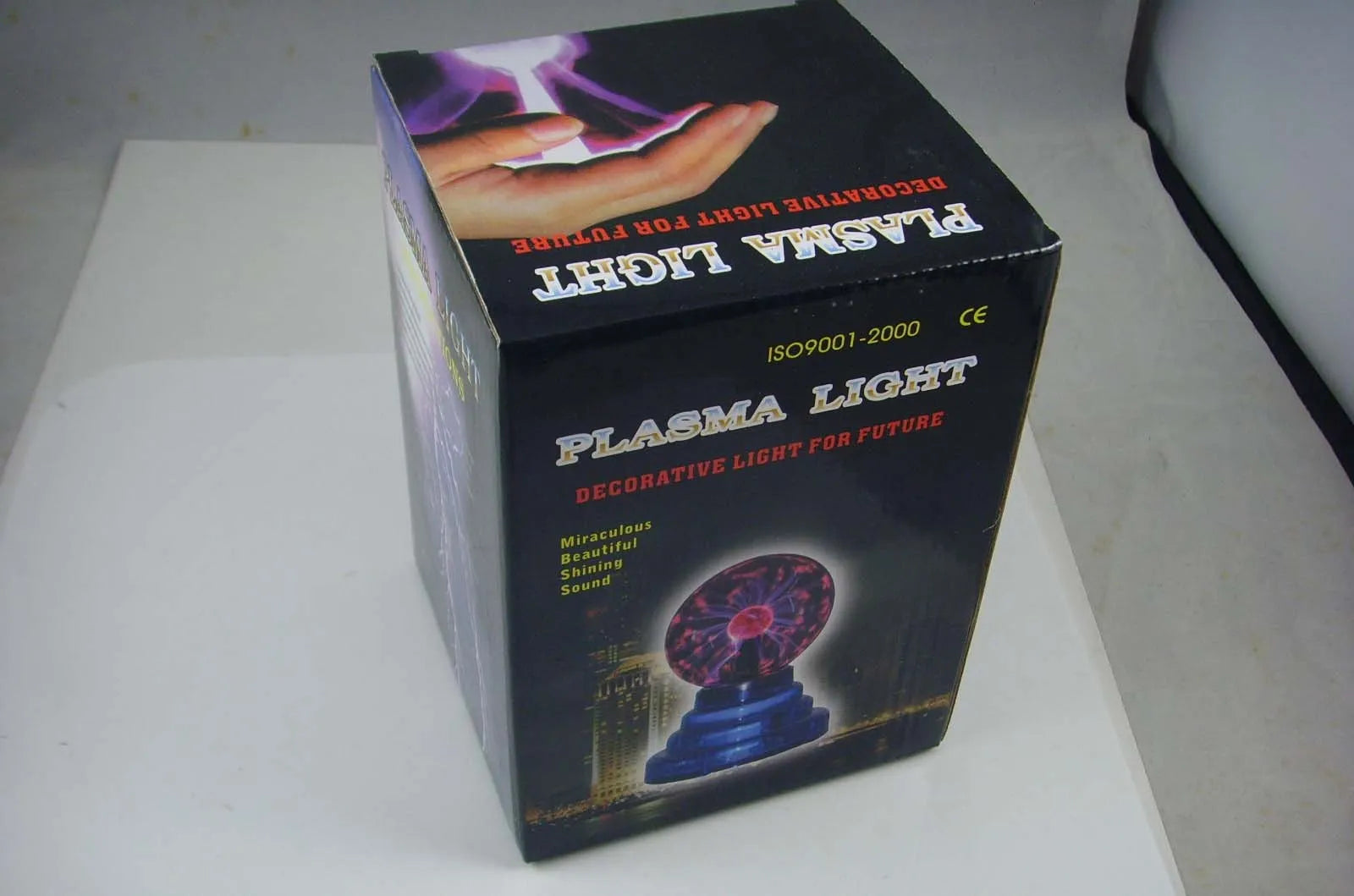 Anti-radiation magic ball light with colourful glow, 7.62cm glass sphere and ABS base on a desk