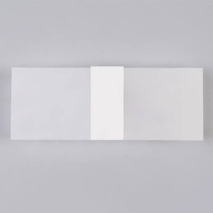 Modern LED bedside wall lamp with acrylic shade, 27x10cm, in black finish, mounted on a wall