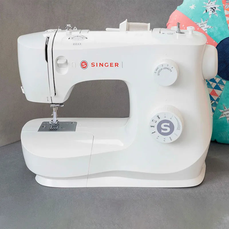Portable household sewing machine M2405 on a table, compact design, 47x39x26cm, for thick fabric sewing