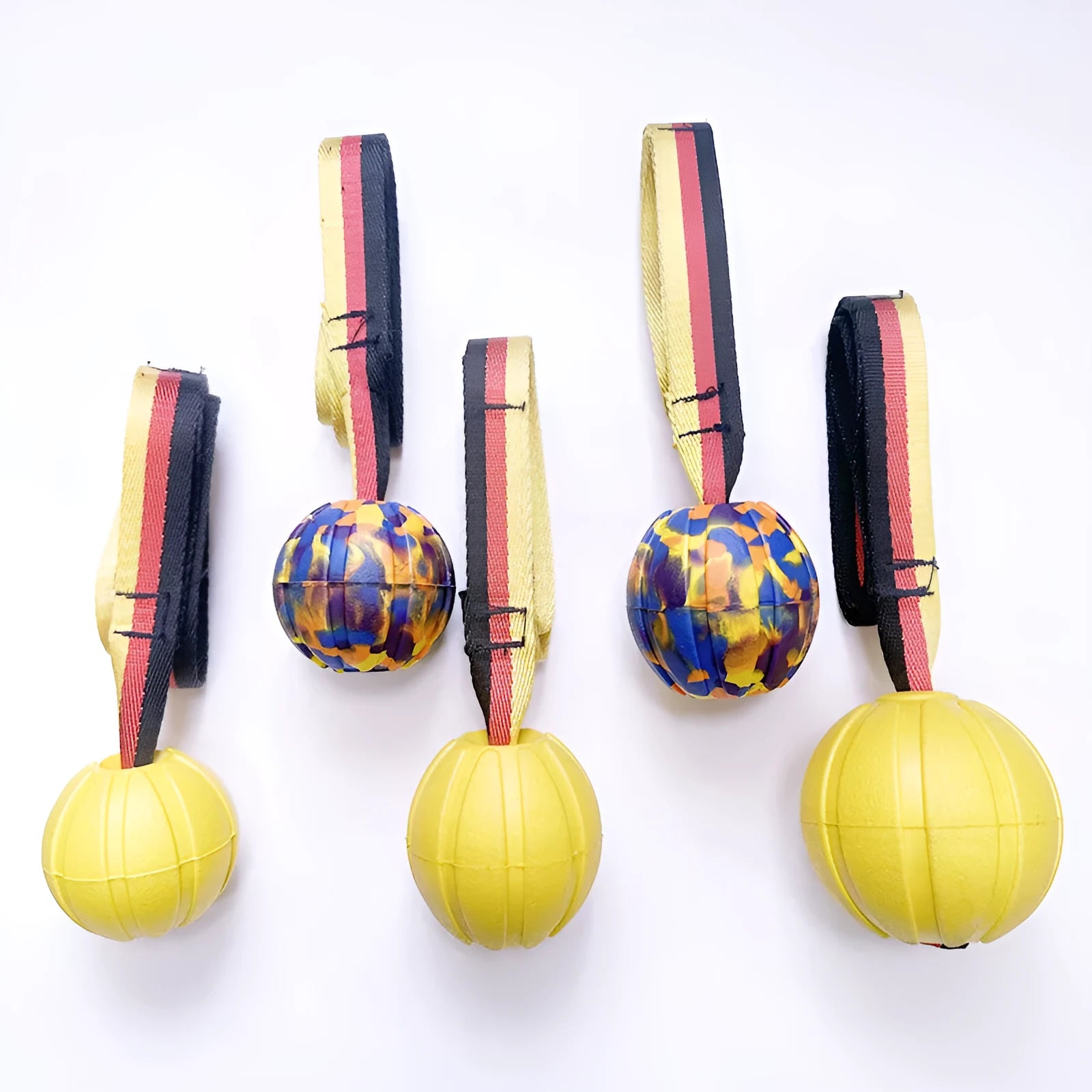 Floating EVA water training ball for dogs in camouflage and yellow colours showing different size options