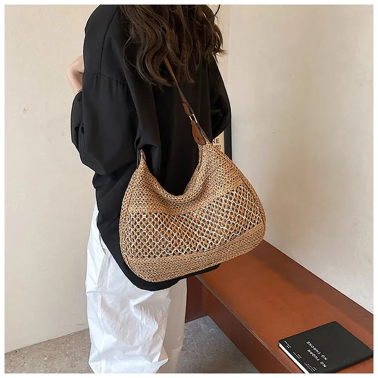 Women's straw cross body bag in khaki colour showing horizontal square shape and sandwich pocket design
