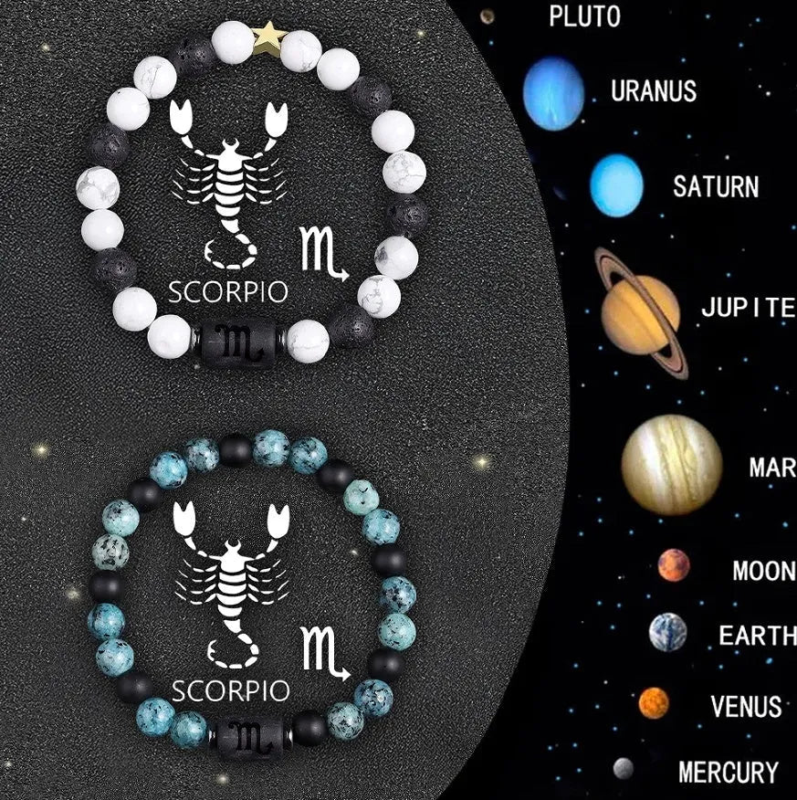 Two natural stone beaded bracelets with zodiac charms on a table, showing adjustable sliding knots.