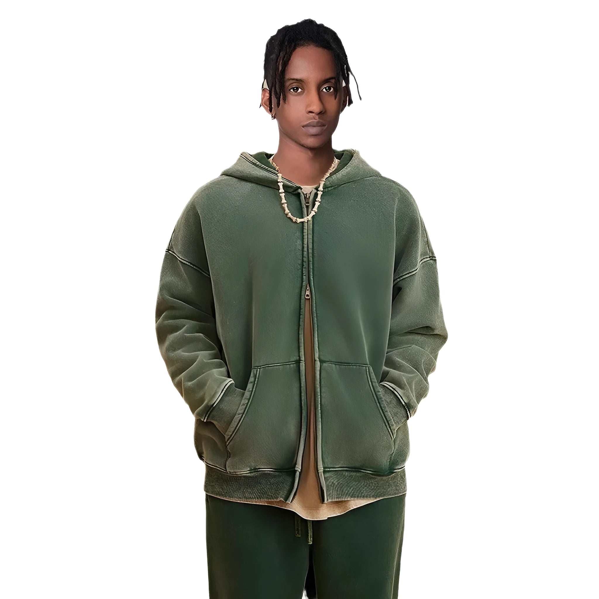 Man wearing a vintage washed dark green hooded cardigan with a double zipper and fleece lining.
