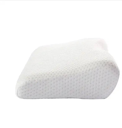 Cervical pillow with memory cotton and butterfly shape in blue, 50x30cm size, on a bed