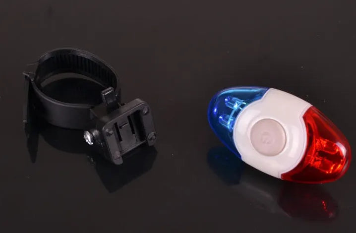 Red and blue LED tail light with adjustable mounting base showing horizontal and vertical positioning options