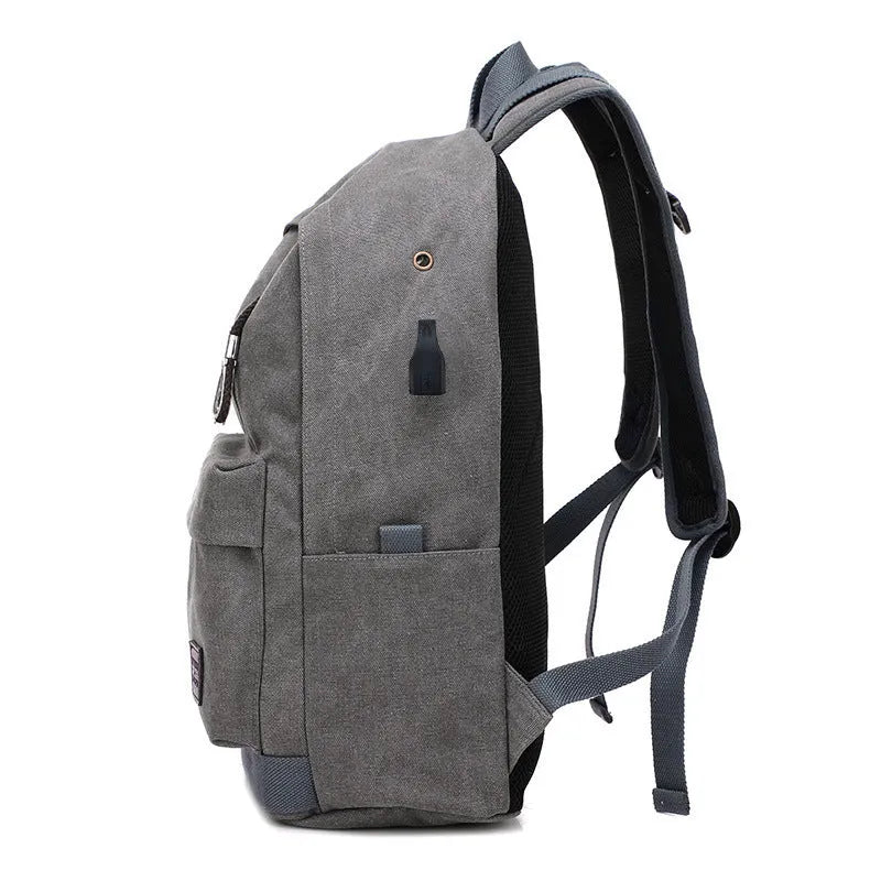 Canvas backpack with USB charging port showing coffee colour variant with laptop compartment