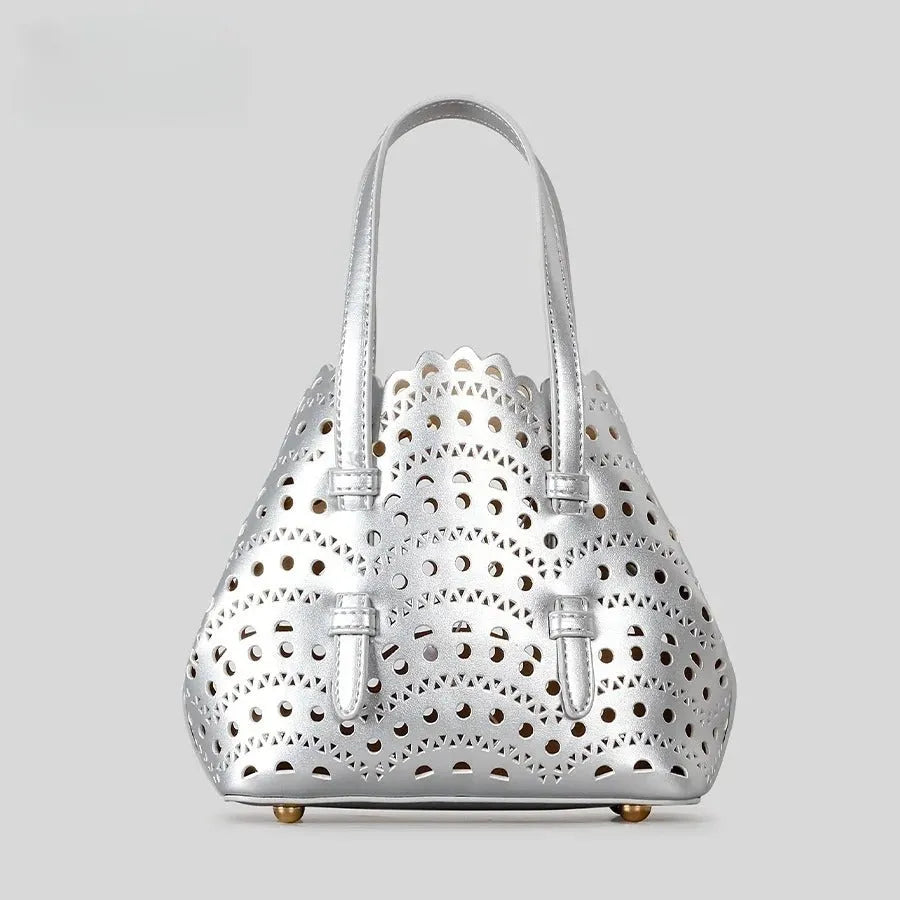 Hollow carved PU leather tote bag in apricot colour with three shoulder straps, horizontal square shape